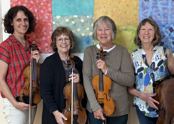 4 players standing, holding their stringed instruments