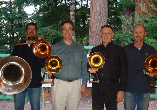 Trombones@4: 4 players holding 4 trombones plus a tuba
